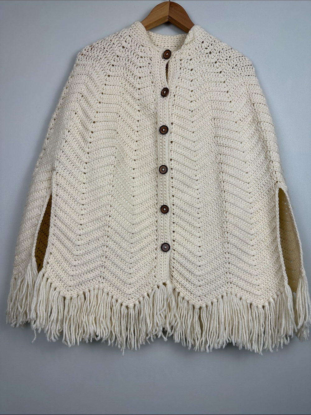 104. Handknit handmade, poncho, shawl, fringe cream, wood buttons minimalist.